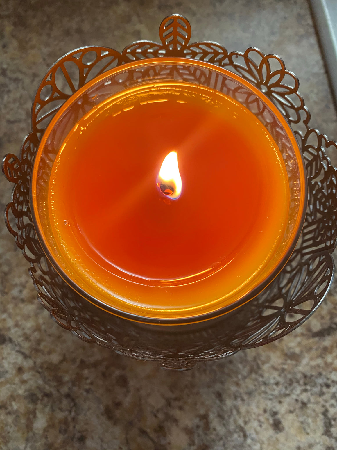 Glass Peach scented candle lit.